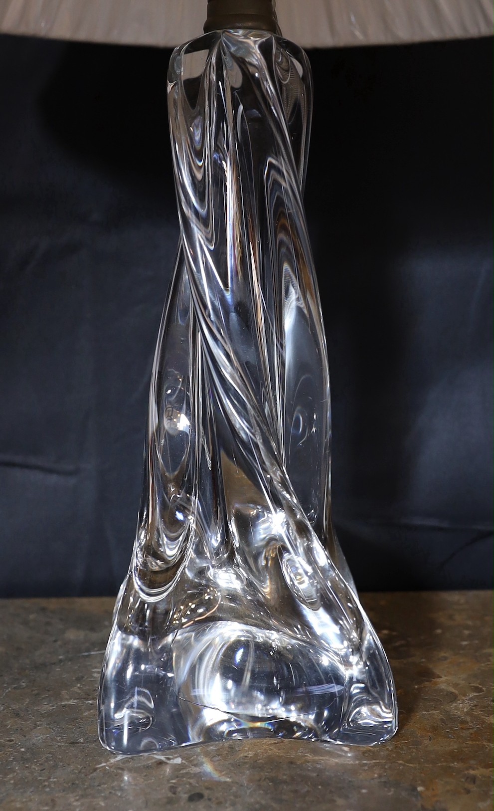 A 1960s Baccarat clear crystal glass table lamp, of twisted form, with replacement pleated silk shade, height 35cm